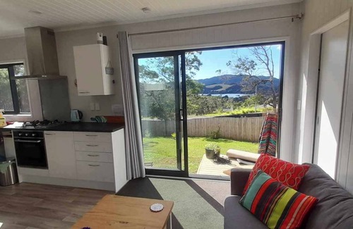Mangonui Casa | Itzy Bitzy house is colourful, cosy, fully fenced with sea views