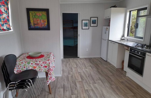 Mangonui Casa | Itzy Bitzy house is colourful, cosy, fully fenced with sea views
