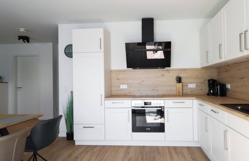 Tossens Apartamento | KÜSTE33/33 - Sauna. Balcony. Family-friendly.