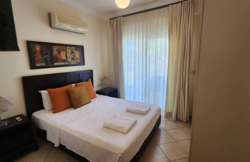 Mentese Casa | Kum plaja sahip, çocuklar için mini club ve kaydıraklı havuzu mevcut