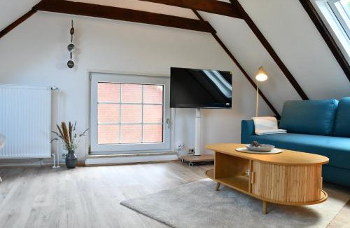 Norden Casa | Lüttje Koje - Ferienhaus direkt am Deich und dem Meer dahinter