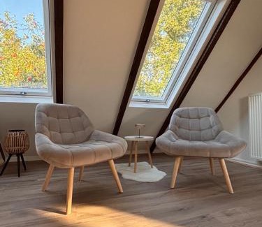Norden Casa | Lüttje Koje - Ferienhaus direkt am Deich und dem Meer dahinter