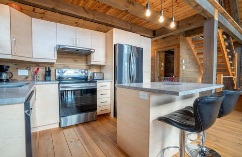 Mauricie Casa | L'Inukshuk - Chalet en bois ave Spa