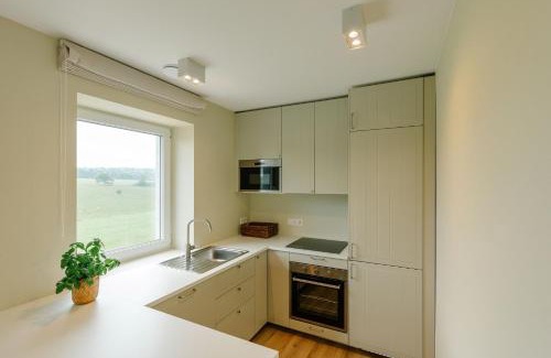 Ciney Casa | La Ferme d'Auwez - Horizon - Gîte 6 pers avec piscines et sauna