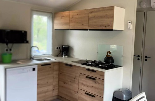 Daglan Casa | La Peyrugue Campsite * - TUSCANY Cottage: 3 bedrooms - TV - Air conditioning - Dishwasher - Covered terrace - 6 people