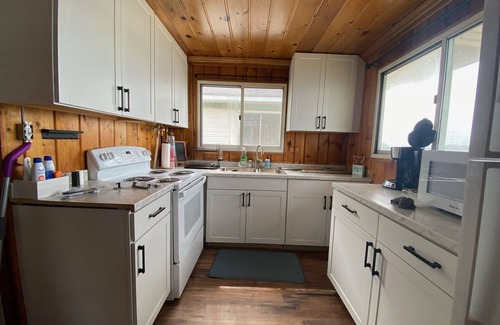National City Cabaña | Lake/beach front property with kayaks, pedal boat, & row boat, near Tawas Bay