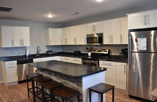 Monroe City Casa | Lake cabin sleeps 18+ w/ a hot tub near Mark Twain Lake and waterpark!