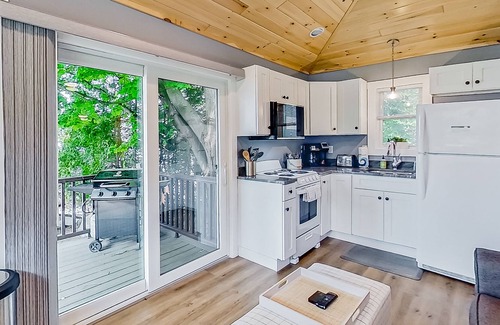 Lake George Cabaña | Lake cabin with waterfront views, shared dock, private deck, grill, & kayaks