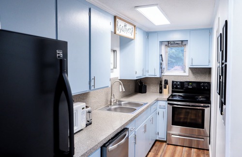 Hickory Cabaña | Lake front home 25 ft from water w/ private dock, firepits, kayaks & paddle boat
