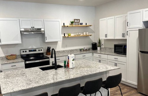 Garfield Casa | LAKEFRONT Bliss FLAT to water: Spacious home with Game Room, Sleeps 15 Guests!
