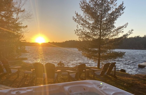 Leeds and the Thousand Islands Cabaña | Lakefront, colourful sunsets, hot tub, arcade. Year round fun and relaxation.