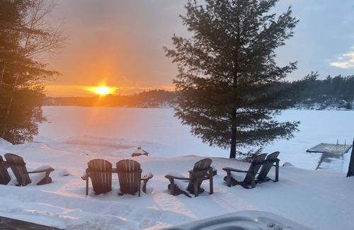 Leeds and the Thousand Islands Cabaña | Lakefront, colourful sunsets, hot tub, arcade. Year round fun and relaxation.