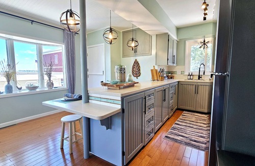 Bluffton Casa | Lakefront cottage on Muskegon Lake! Fire pit, 40' BOAT DOCK, near beach, shops
