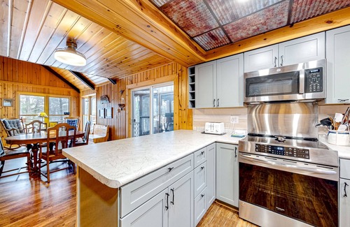 Lac du Flambeau Cabaña | Lakefront dog-friendly retreat with sauna, dock, canoe, paddle board, & firepit