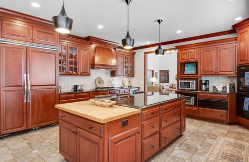 Arkdale Casa | Lakefront estate with firepit, grill, game room & sauna - near Sand Valley Golf