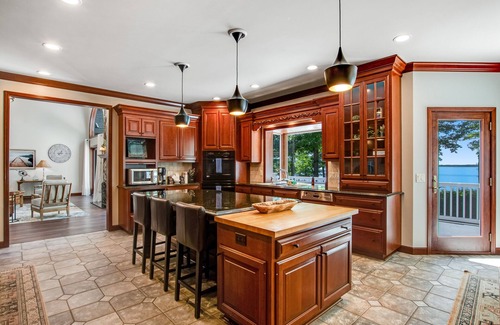 Arkdale Casa | Lakefront estate with firepit, grill, game room & sauna - near Sand Valley Golf
