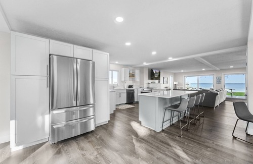 Prudenville Casa | Lakefront - Spacious Family Getaway with Dock!
