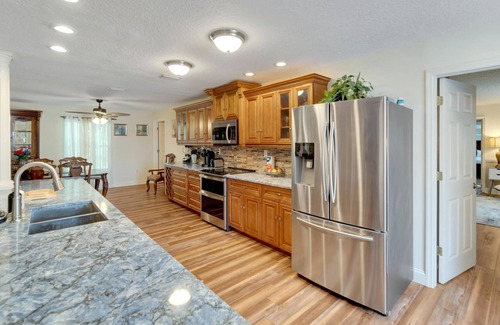 Seffner Community Alliance Casa | Lakefront Getaway - Luxurious Home - Pool & Games