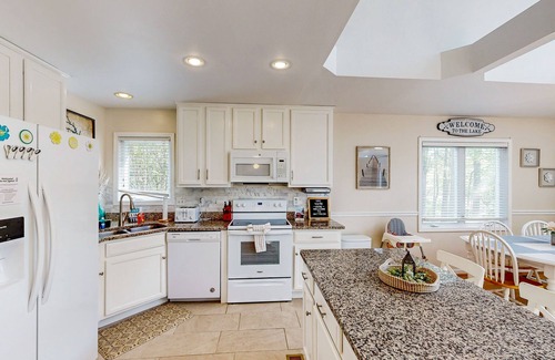 Bumpass Casa | Lakefront home with brand-new hot tub, dock, kayaks, SUP, game room & firepit