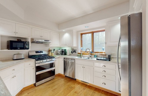Hazelhurst Casa | Lakefront home with private outdoor sauna, dock, firepit, wood fireplace & patio