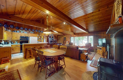 Eagle River Casa | Lakefront log cabin on Stone Lake w/2 docks, fire place, paddle boat, & WIFI