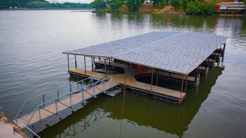 Lake Ozark Casa | Lakeshore Fishing Cabin 5, dock, boat slip and firepit area