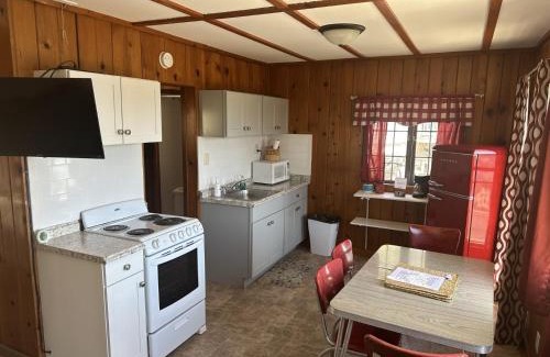 Lake Ozark Casa | Lakeshore Fishing Cabin 5, dock, boat slip and firepit area