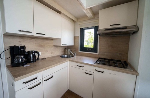 Bovenkarspel Casa | Cabaña junto al lago con jardín