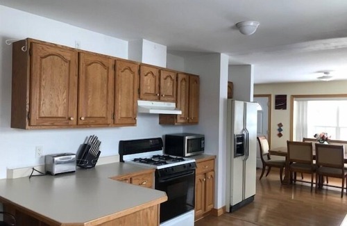 Presque Isle Casa | Lakeside Luxury, 4 bedrooms, 2 bath, sleeps 10. Outdoor Grill, Kayaks, Firepit.