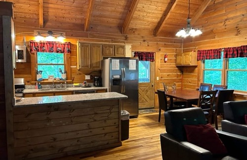 Zoe Cabina | Large Log home, private pond with dock, canoe, pool table, hot tub & internet.