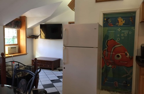 College Apartamento | Gran ático con cama King Canopy