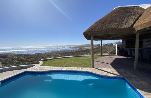 St. Helena Bay Villa | Large villa with warm pool on the beach