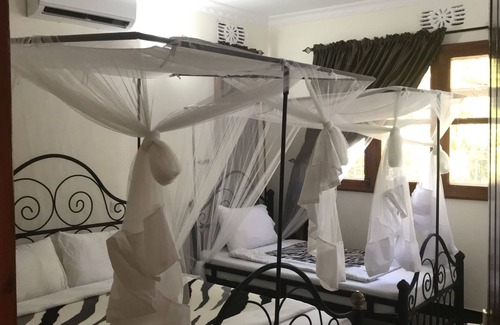 Boma la Ngombe Casa | Le Parlour