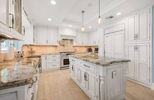 Palm City Casa | Light House Point Canal Front Pool Home with Dock and Ice Machine