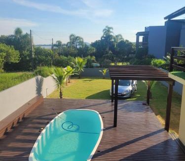 Ibiraquera Casa | LINDA CASA COM PISCINA DE FRENTE PARA A LAGOA