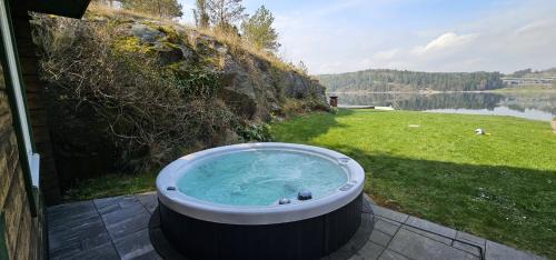 Torreby Casa | Log cabin with pool, sauna and boat by Torreby Castle