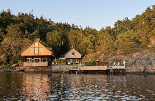 Torreby Casa | Log cabin with pool, sauna and boat by Torreby Castle