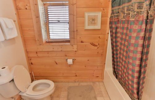 Gatlinburg Casa | Log Inn, 5 bed 3 bath group cabin in Gatlinburg with game room and hot tub, seasonal resort pool