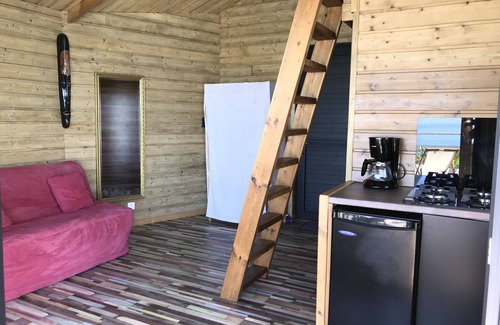 L'Etang-Sale Casa | Salón de la alta vista panorámica entre el océano y las montañas.