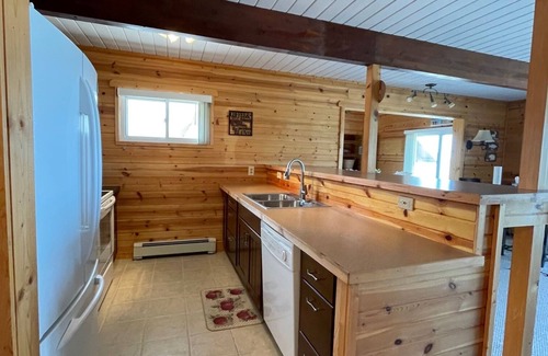 Cheboygan Casa | Lovely Chalet Home on Quiet Bay with Sandy Beach