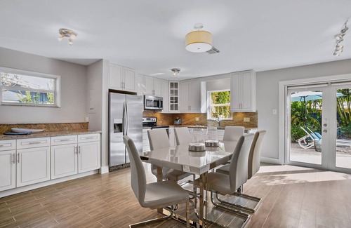 Coral Heights Casa | Lovely Vacation Home with a tropical private yard and heated pool near the Beach