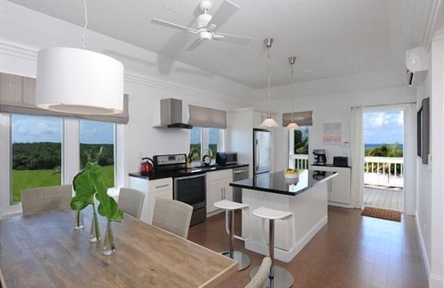 James Cistern Condominio | Ático nuevo con Htd. Piscina, muelle, playa privada, vista al mar, kayaks, carrito de golf