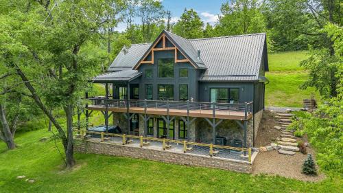 Lansing Casa | Lux Riverfront Retreat- Hot Tub, Game Room, Views!