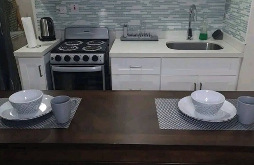 Portmore Apartamento | Luxuriate poolside or on the private beach at this comfy studio apartment.