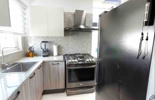 Ensanche Quisqueya Casa | Luxurious 2BR condo with Rooftop, jacuzzi and BBQ