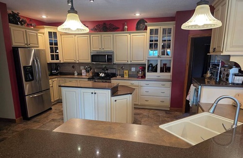 Geneseo Casa | Luxury 5 BR home on private wooded lot near QC, w/hot tub, rec & fitness room