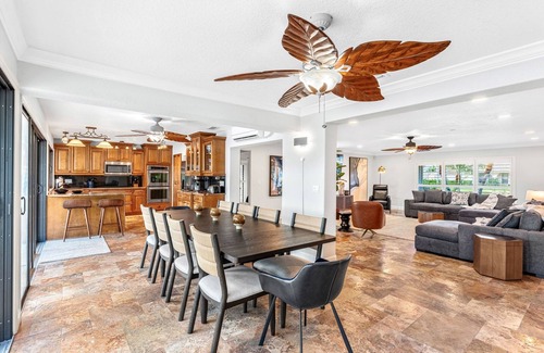 Cocoa Isles Casa | Luxury Canalfront Home w/ Heated Pool, Game Room, Boat & Jet Ski Lifts