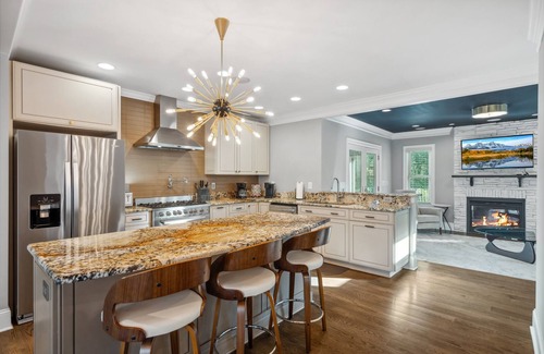 Commonwealth Park Casa | Luxury Charlotte Home with Stunning Pool & Hot Tub & Waterfalls