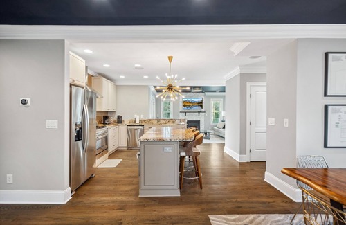 Commonwealth Park Casa | Luxury Charlotte Home with Stunning Pool & Hot Tub & Waterfalls