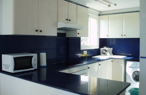 Sant Carles de la Rapita Apartamento | Urbanización lujo frente al mar, piscina y garaje
